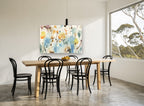 Loose Meadow Wash floral canvas print on the wall of a dining room