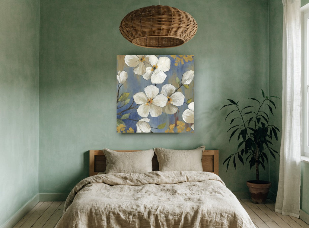 White Blossoms on Blue floral canvas print on the wall of a bedroom