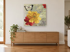 Yellow Bloom and Butterfly vintage canvas print on the wall of a living room above a sideboard