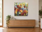 Ember Poppy Meadow floral canvas print on the wall of a living room above a sideboard