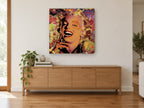 Laughing Pop Portrait vintage canvas print on the wall of a living room above a sideboard