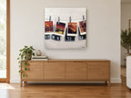 Postcards Pegged Out city canvas print on the wall of a living room above a sideboard