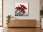 Crimson Poppy Trio floral canvas print on the wall of a living room above a sideboard
