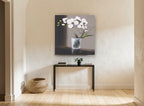 White Orchid in Glass floral canvas print on the wall of a hallway