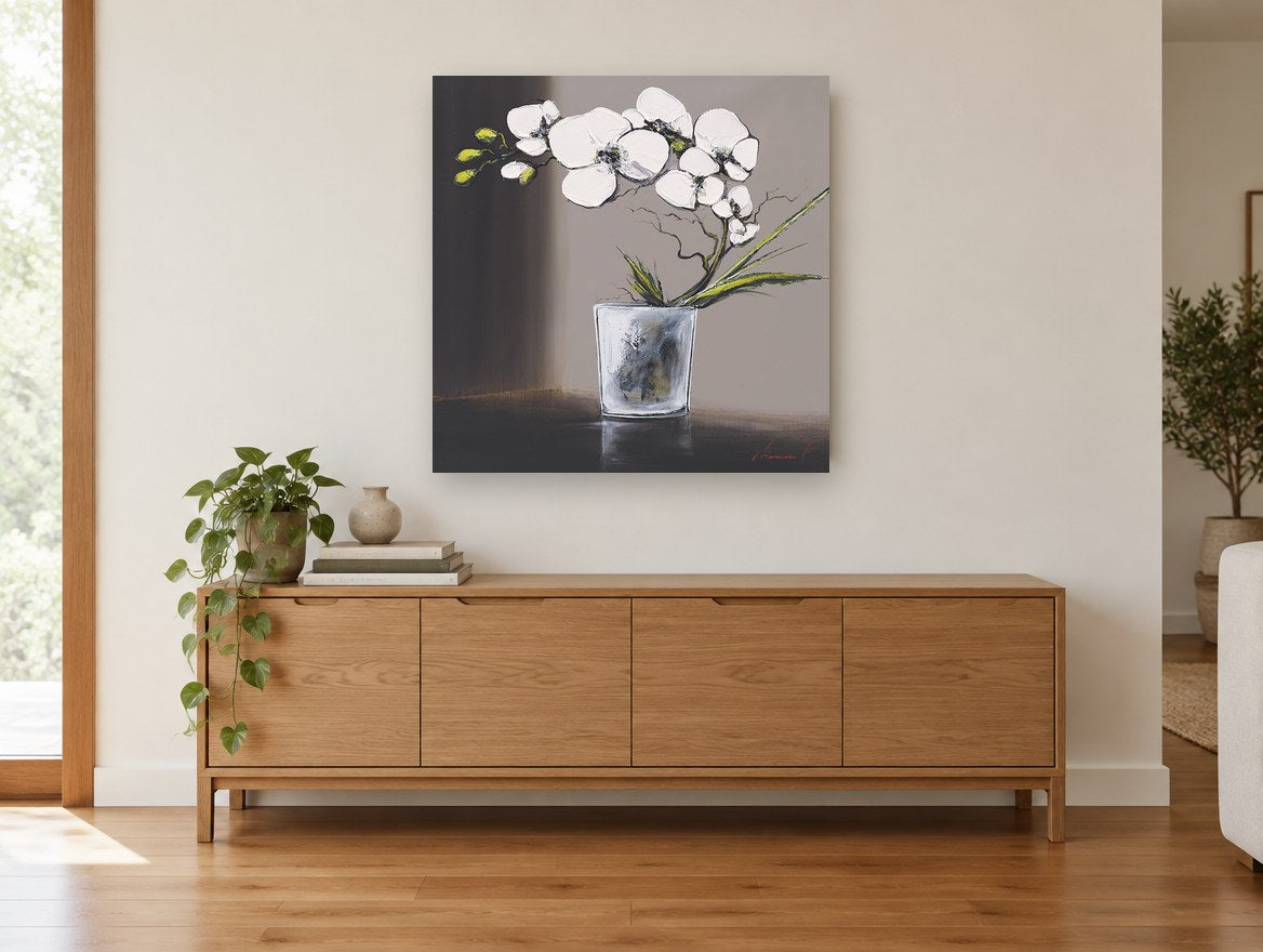 White Orchid in Glass floral canvas print on the wall of a living room above a sideboard