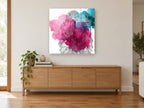 Dahlia Ink Bloom floral canvas print on the wall of a living room above a sideboard