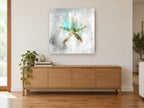 Aqua Starfish Silhouette coastal canvas print on the wall of a living room above a sideboard