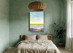Golden Shoreline Haze landscape canvas print on the wall of a bedroom