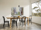 Misty Birch Hollow floral canvas print on the wall of a dining room