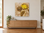 Turned Sunflower Bud floral canvas print on the wall of a living room above a sideboard