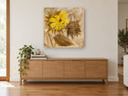 Turning Sunflower Pair floral canvas print on the wall of a living room above a sideboard