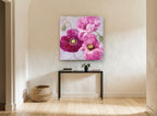 Magenta Poppy Trio floral canvas print on the wall of a hallway