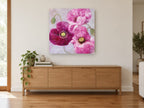 Magenta Poppy Trio floral canvas print on the wall of a living room above a sideboard