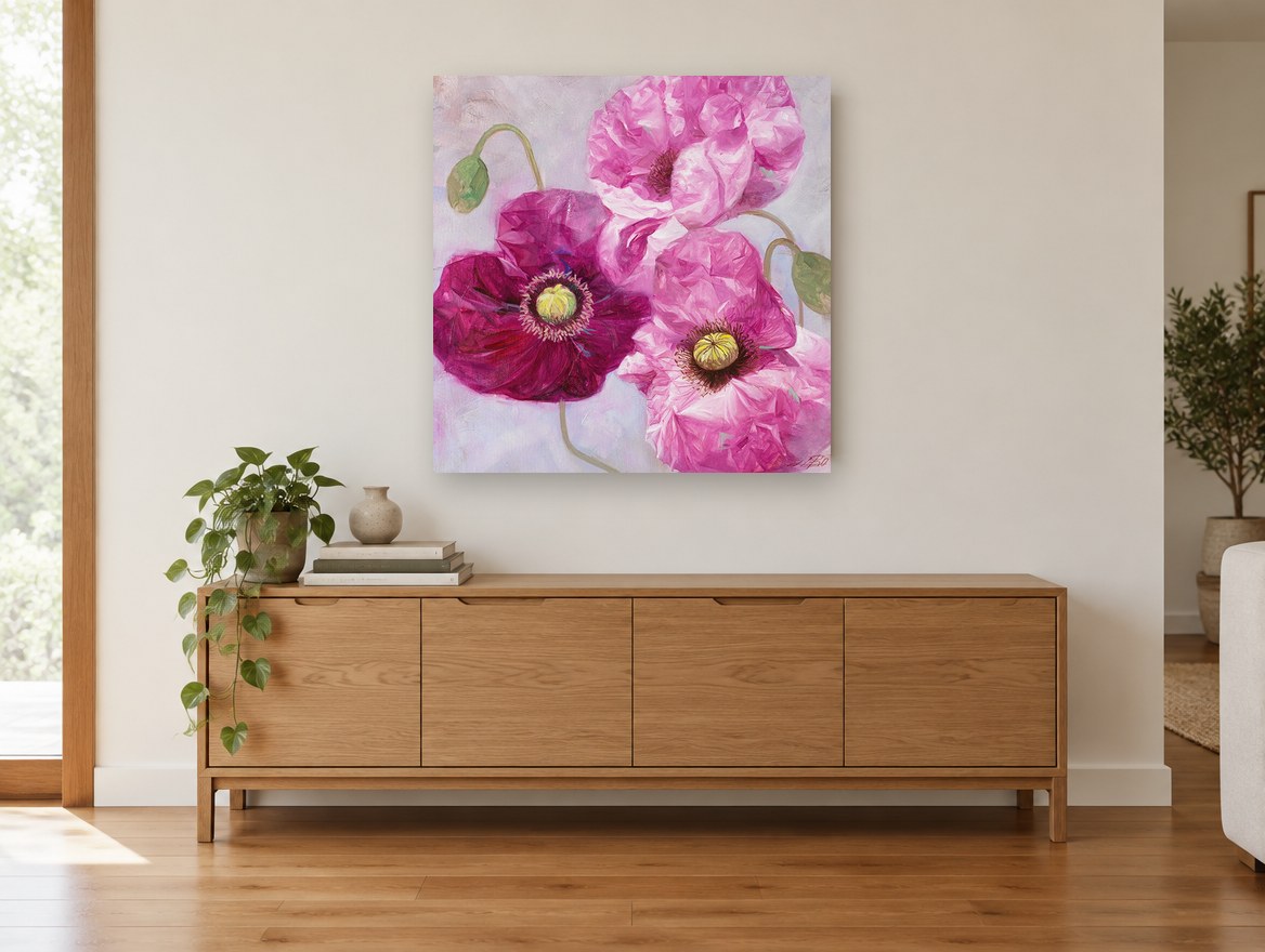 Magenta Poppy Trio floral canvas print on the wall of a living room above a sideboard