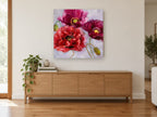 Crimson Poppy Trio floral canvas print on the wall of a living room above a sideboard
