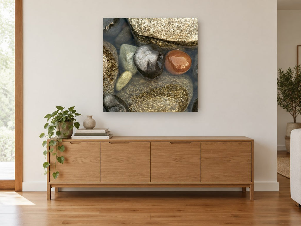 Wet Pebble Pool coastal canvas print on the wall of a living room above a sideboard
