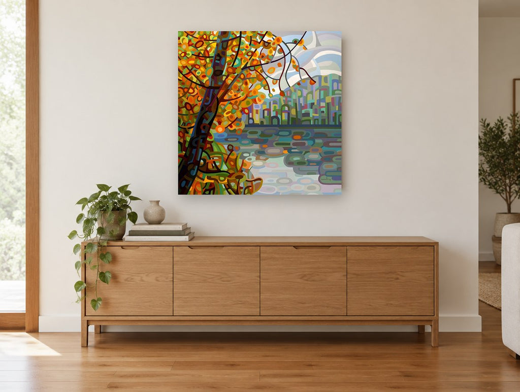 Autumn Tree Over Lake landscape canvas print on the wall of a living room above a sideboard