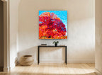 Crimson Ribbon Tree floral canvas print on the wall of a hallway