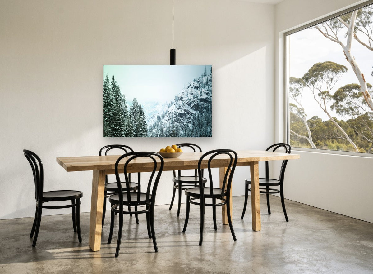 Frosted Pine Ridge landscape canvas print on the wall of a dining room