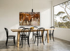 Straw Yard Longhorn animal canvas print on the wall of a dining room