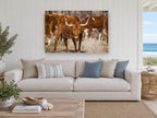 Straw Yard Longhorn animal canvas print on the wall of a beach house living room