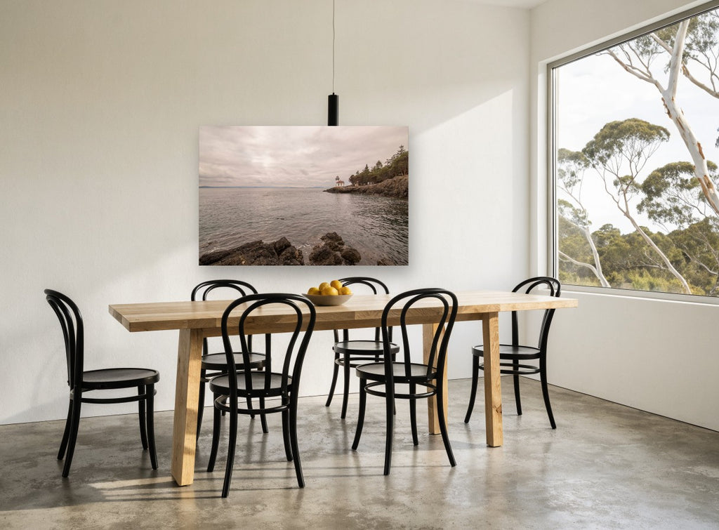 Quiet Point Light coastal canvas print on the wall of a dining room