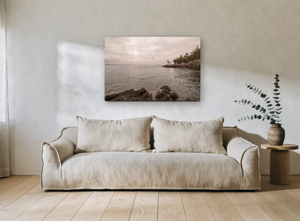 Quiet Point Light coastal canvas print on the wall of a living room