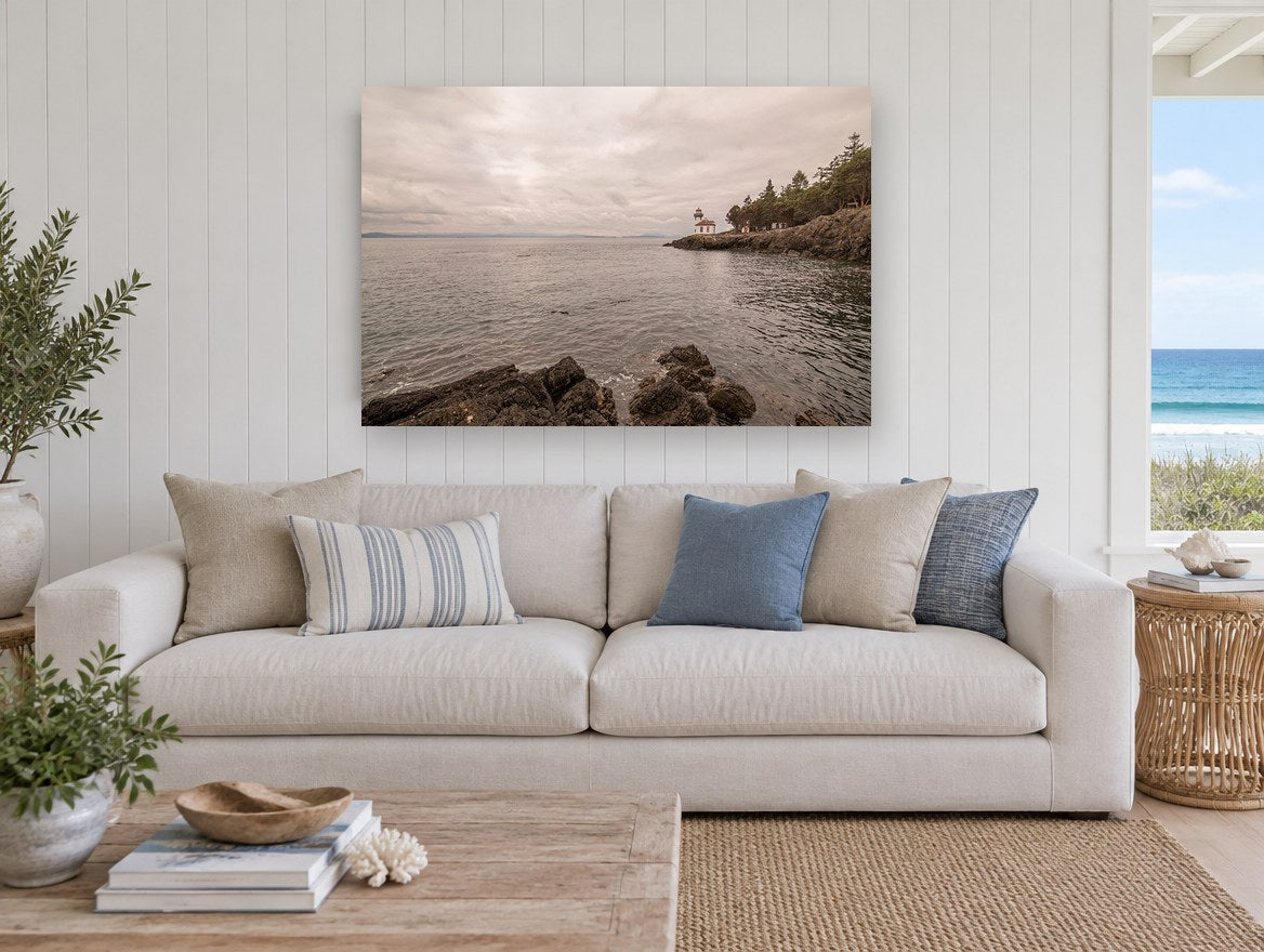 Quiet Point Light coastal canvas print on the wall of a beach house living room