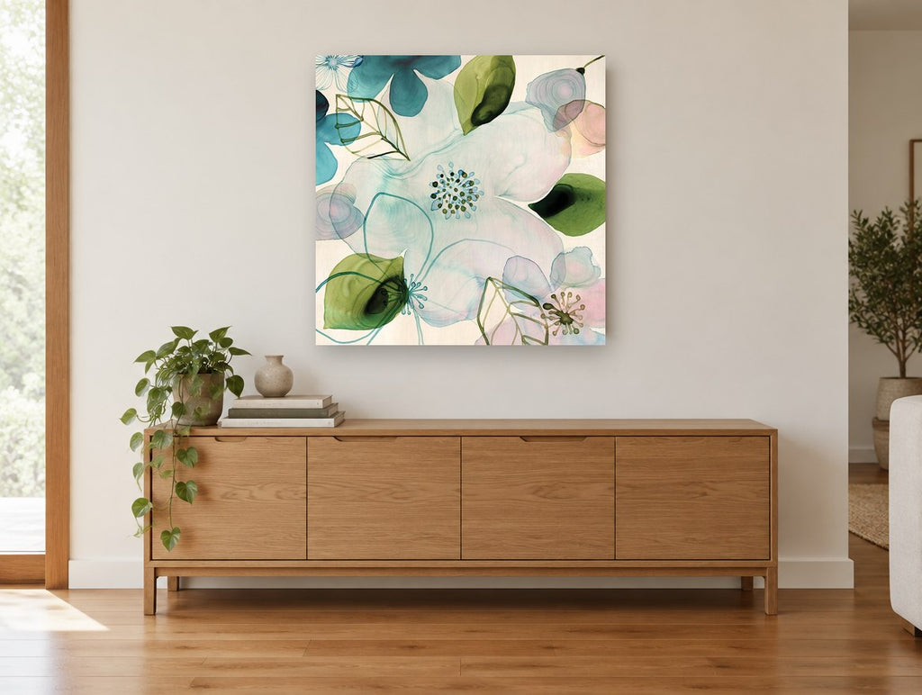 Translucent Teal Blossoms floral canvas print on the wall of a living room above a sideboard