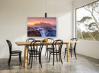 Lighthouse Dawn Tide coastal canvas print on the wall of a dining room