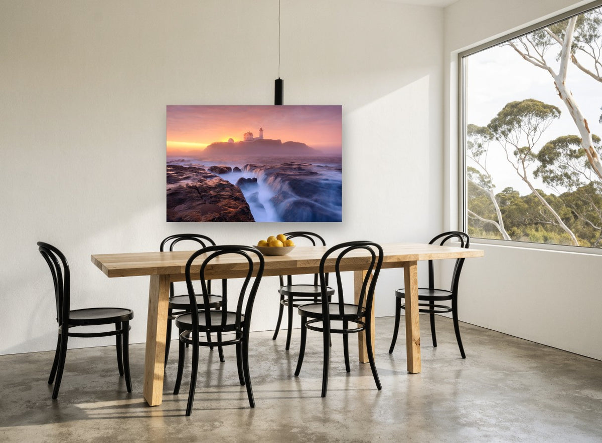 Lighthouse Dawn Tide coastal canvas print on the wall of a dining room