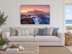 Lighthouse Dawn Tide coastal canvas print on the wall of a beach house living room