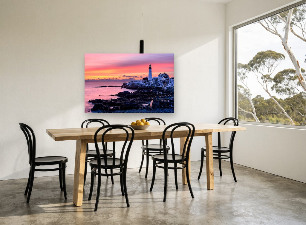 Lighthouse Dawn Glow coastal canvas print on the wall of a dining room