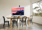 Lighthouse Dawn Glow coastal canvas print on the wall of a dining room