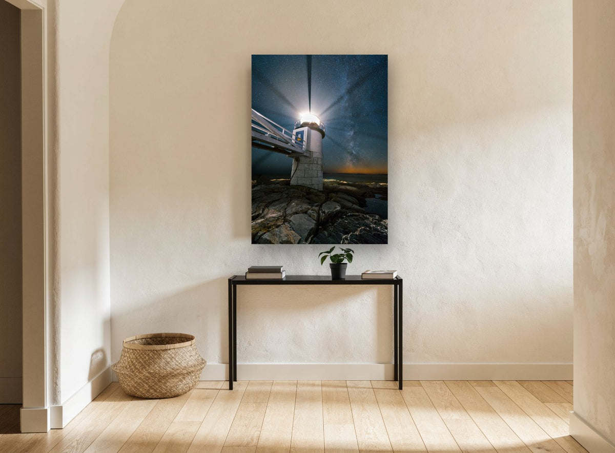 Lighthouse Under Milky Way coastal canvas print on the wall of a hallway