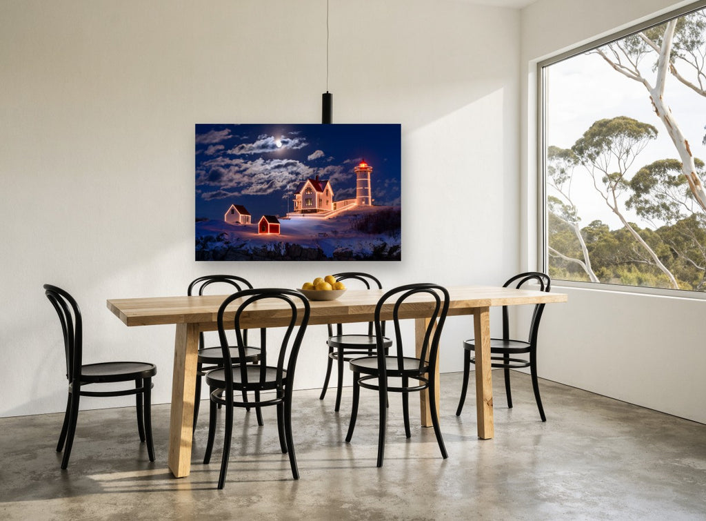 Moonlit Lighthouse Christmas landscape canvas print on the wall of a dining room