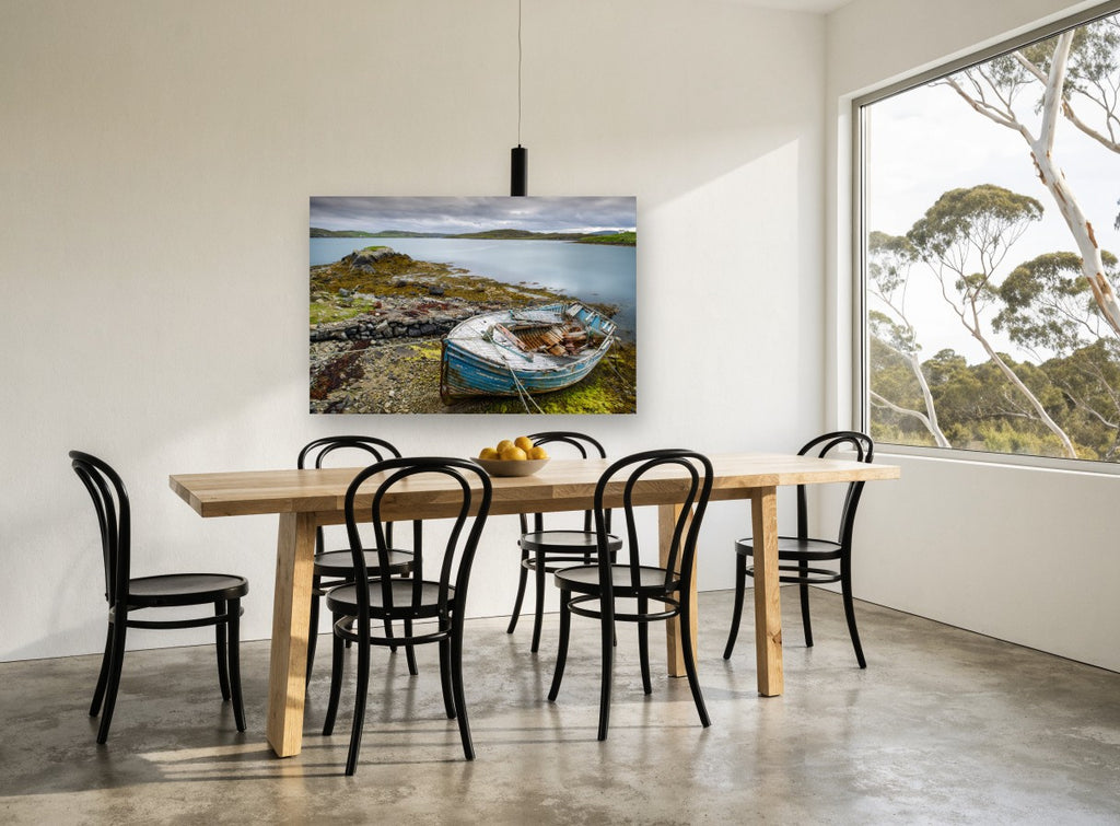 Weathered Blue Dinghy landscape canvas print on the wall of a dining room