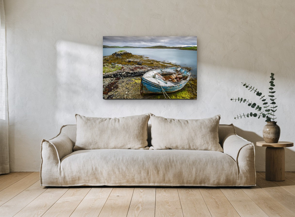 Weathered Blue Dinghy landscape canvas print on the wall of a living room