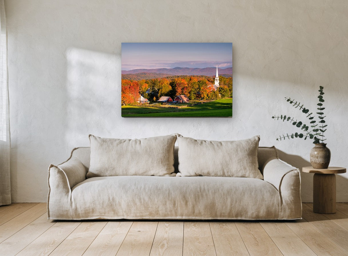 Autumn Village Steeple landscape canvas print on the wall of a living room