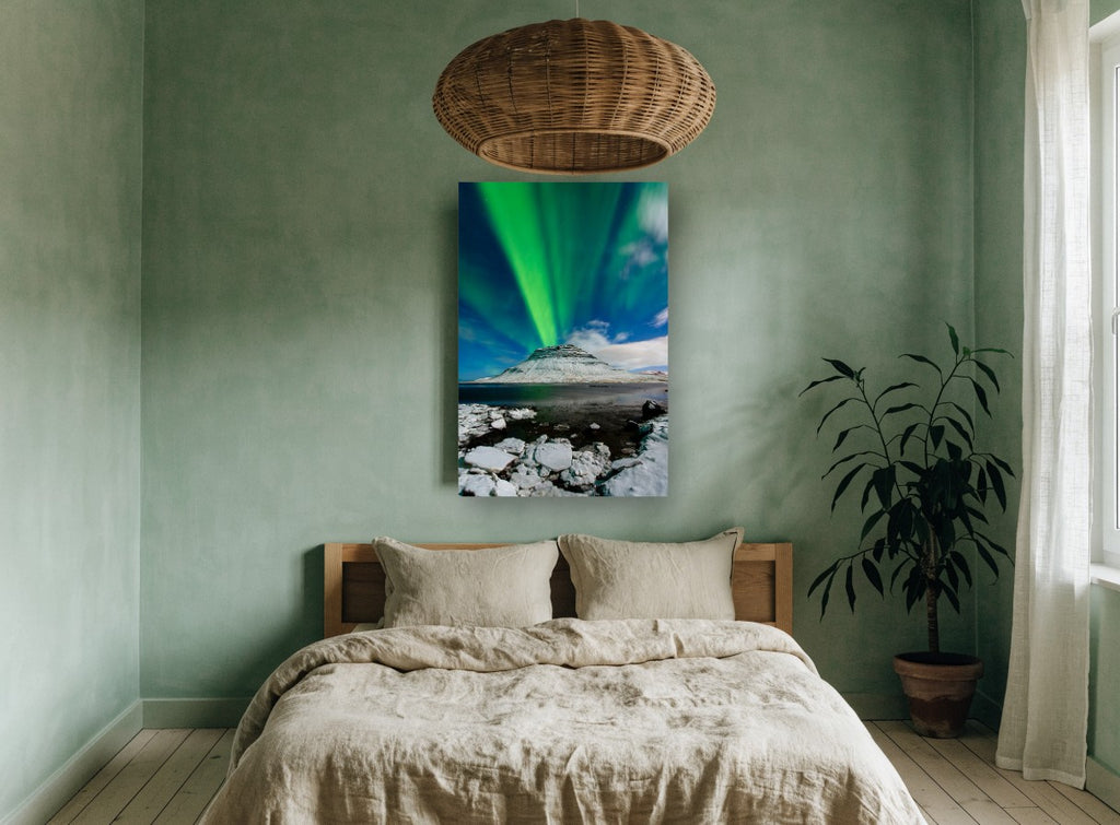 Green Aurora Over Snowy Peak coastal canvas print on the wall of a bedroom