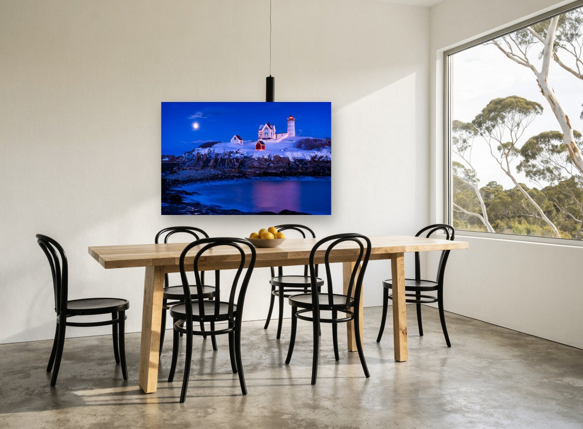 Nubble Winter Night coastal canvas print on the wall of a dining room