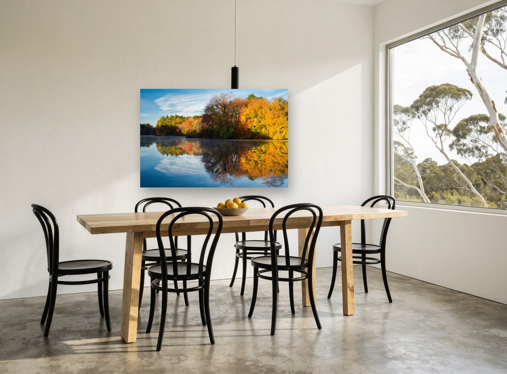 Golden Shoreline Stillness landscape canvas print on the wall of a dining room