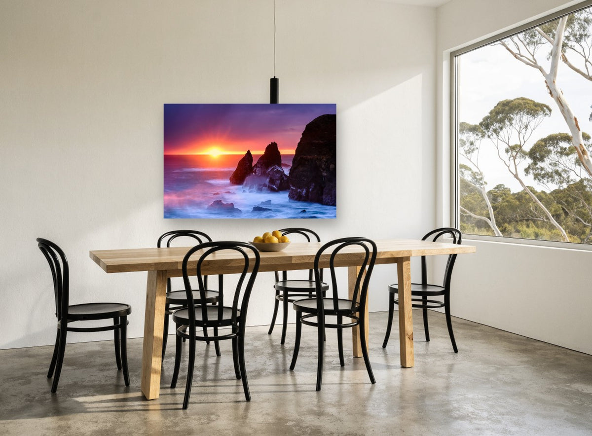 Sunset Sea Stacks coastal canvas print on the wall of a dining room