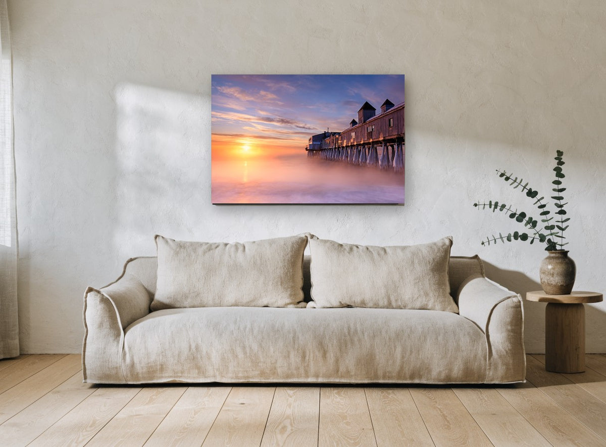 Frozen Pier Sunrise coastal canvas print on the wall of a living room