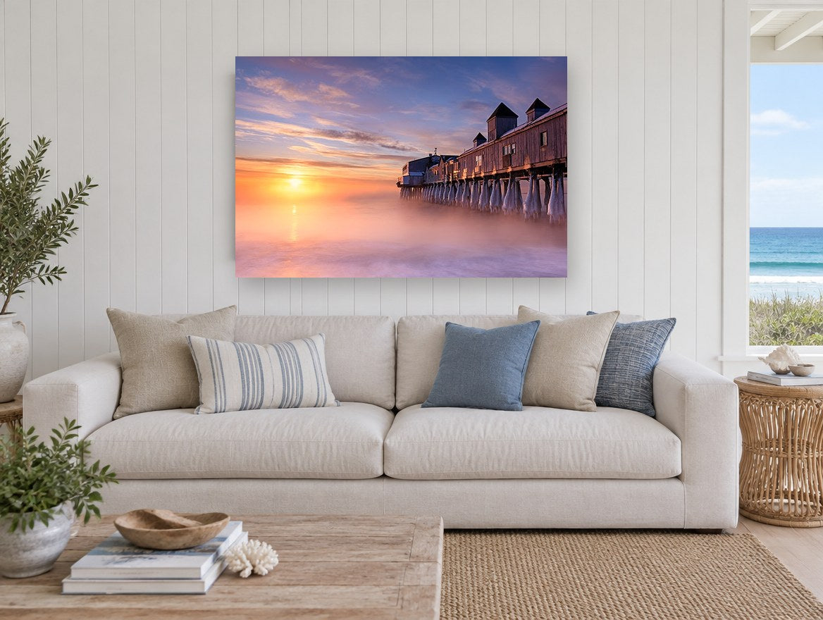 Frozen Pier Sunrise coastal canvas print on the wall of a beach house living room