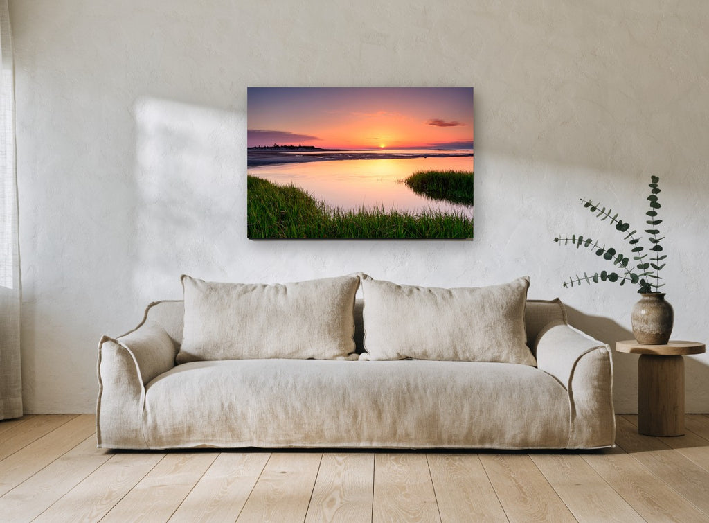 Marsh Tide Sunset coastal canvas print on the wall of a living room