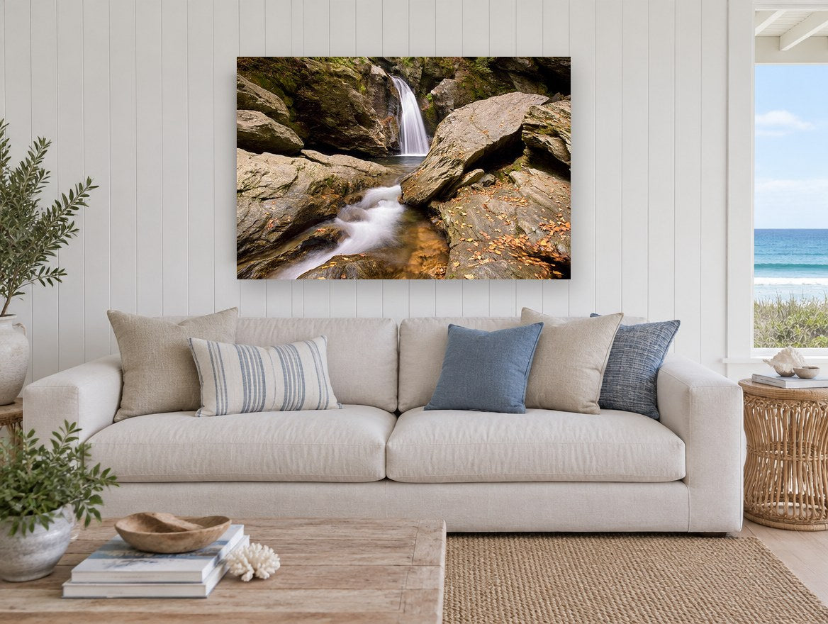 Autumn Falls Gorge landscape canvas print on the wall of a beach house living room