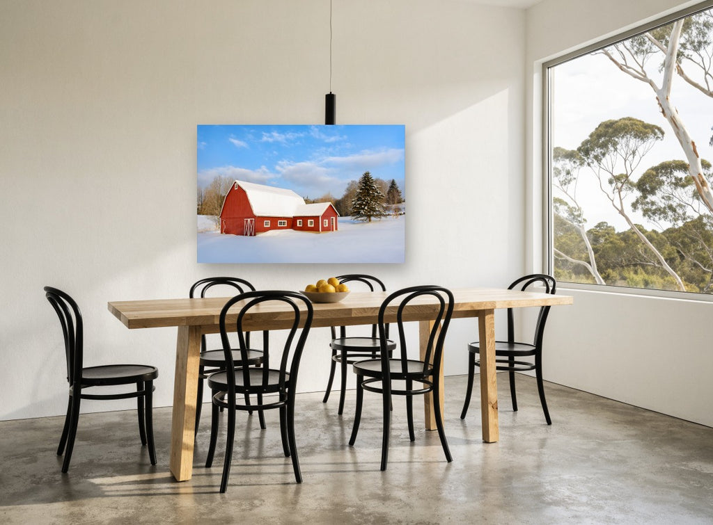 Red Barn Winter Light landscape canvas print on the wall of a dining room