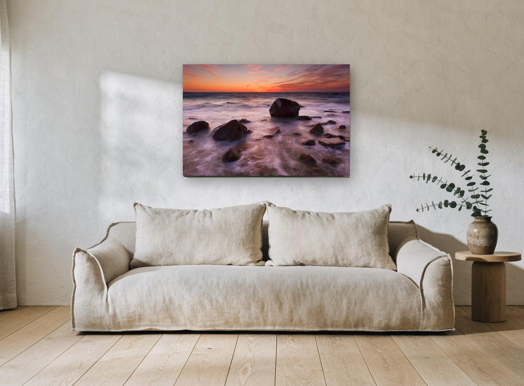 Silken Dusk Boulders coastal canvas print on the wall of a living room