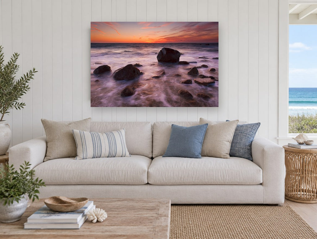 Silken Dusk Boulders coastal canvas print on the wall of a beach house living room